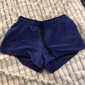 Purple Nike dry fit running shorts